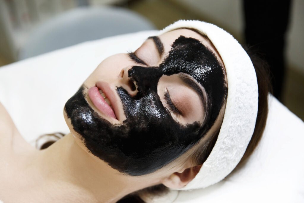 girl-with-black-mask-lies-table-spa-saloon-1024x683